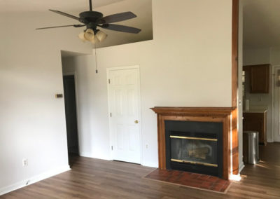 Interior living room with fireplace by BNH Builders